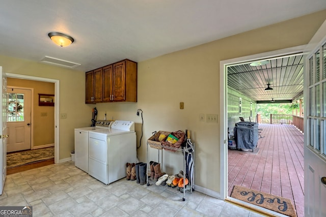 laundry room with cabinets and independent washer and dryer