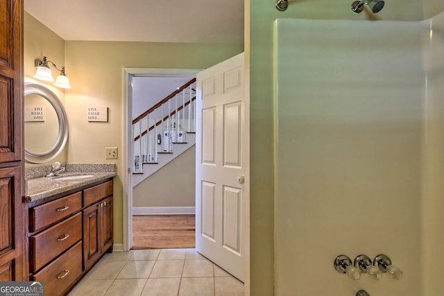 bathroom with tile patterned floors and vanity