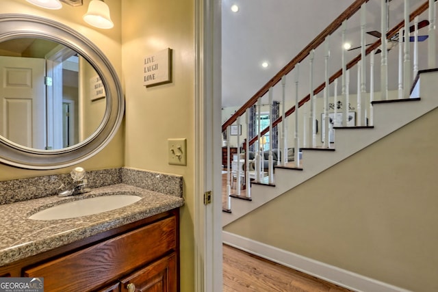 bathroom with vanity and hardwood / wood-style flooring