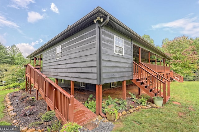 view of side of property with a lawn