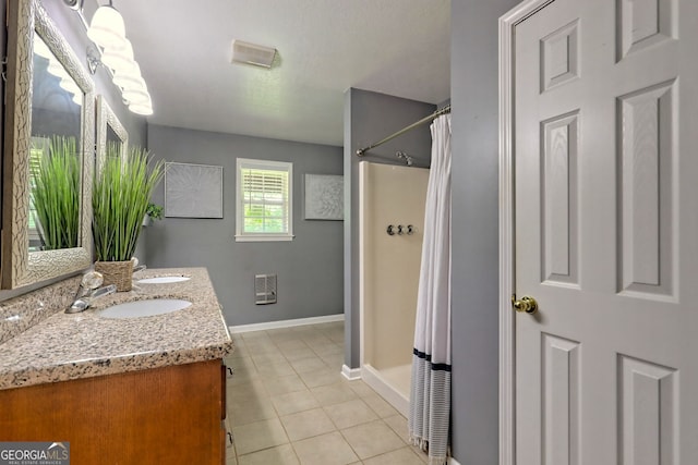 bathroom with tile patterned flooring, vanity, heating unit, and curtained shower