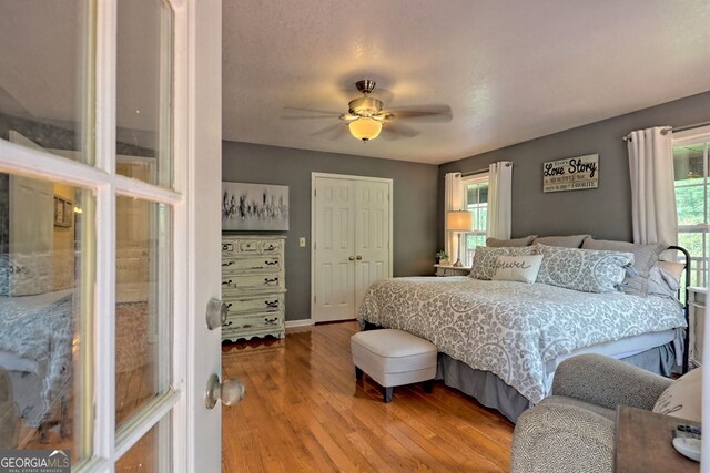 bedroom featuring hardwood / wood-style floors and ceiling fan