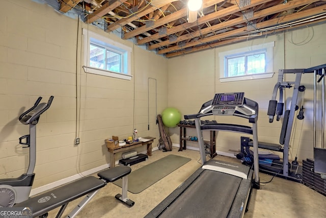 exercise area featuring concrete flooring