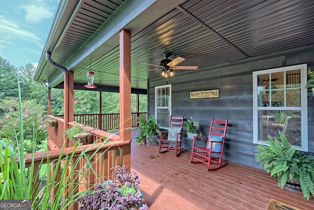 wooden deck with ceiling fan