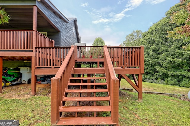 exterior space featuring a wooden deck and a lawn