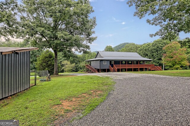 view of yard featuring a wooden deck