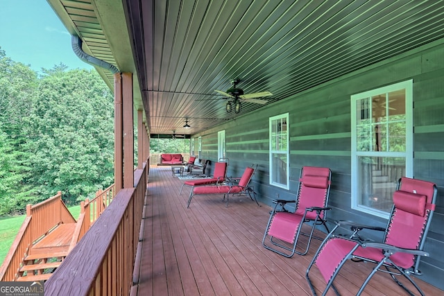 wooden deck featuring ceiling fan