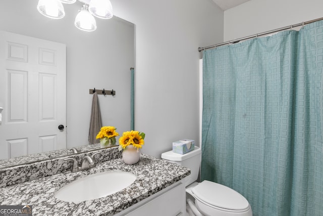 bathroom with vanity and toilet