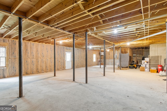 basement with stainless steel refrigerator