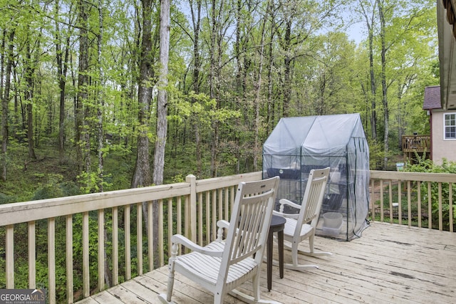 140 Wisteria Blvd, Covington, GA 30016 - wooden deck featuring a wooded view