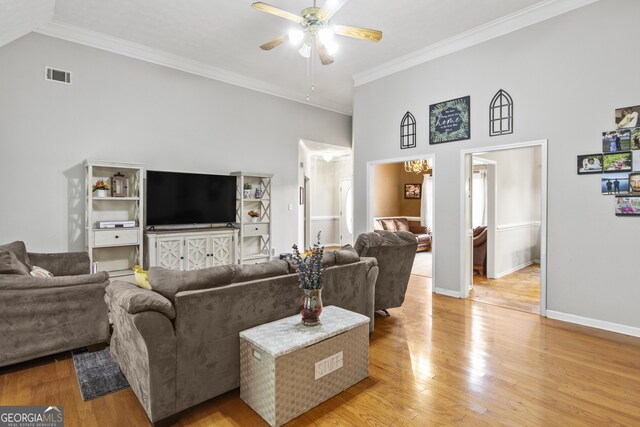 140 Wisteria Blvd, Covington, GA 30016 - living room with visible vents, crown molding, light wood-style floors, and a ceiling fan