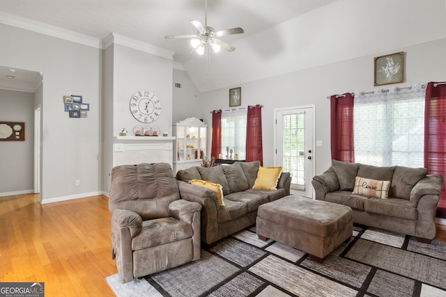 living room featuring vaulted ceiling, ceiling fan, light hardwood / wood-style flooring, and ornamental molding