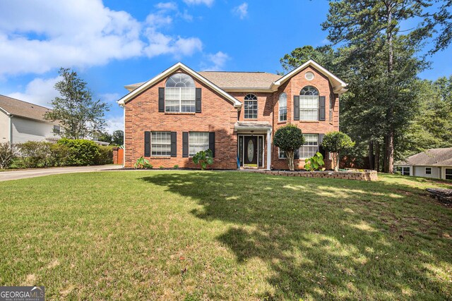 view of property featuring a front yard