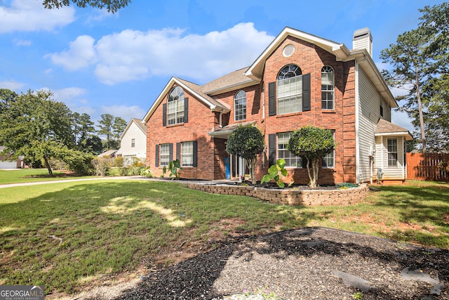 view of property with a front lawn