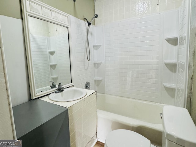 full bathroom featuring toilet, vanity, and  shower combination