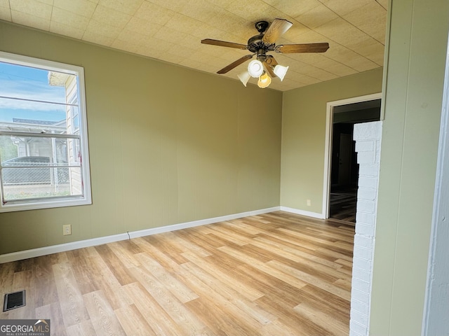 spare room featuring ceiling fan and light hardwood / wood-style floors