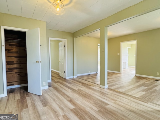 unfurnished bedroom featuring light wood-type flooring