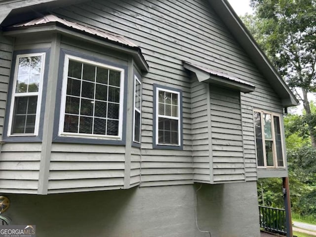 view of home's exterior featuring metal roof