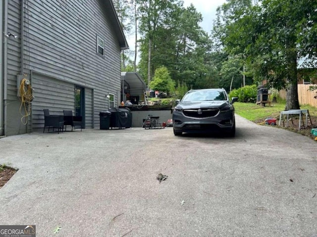 view of car parking featuring driveway