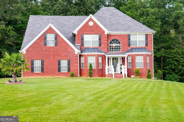 colonial-style house with a front yard