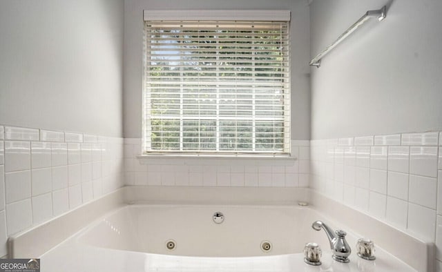 bathroom with a washtub