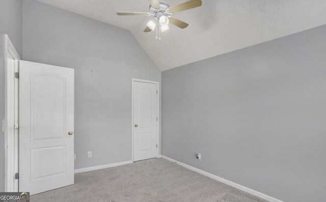 interior space featuring lofted ceiling and ceiling fan