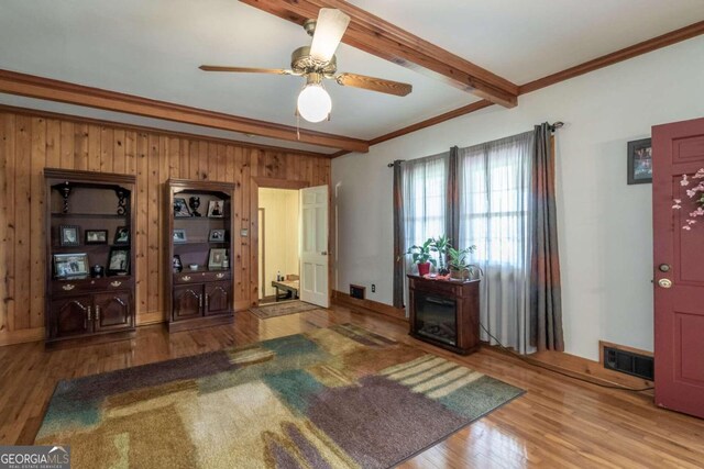 entryway featuring beam ceiling, ceiling fan, and hardwood / wood-style floors