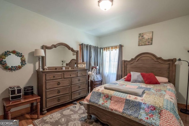 bedroom with hardwood / wood-style flooring