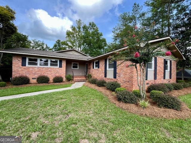 ranch-style home with a front yard