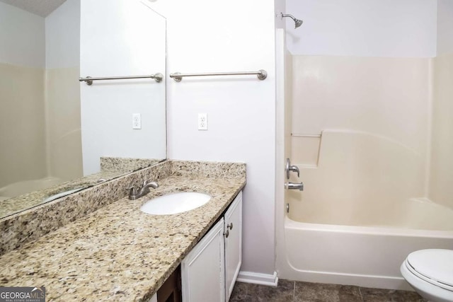 full bathroom featuring bathing tub / shower combination, vanity, tile patterned floors, and toilet