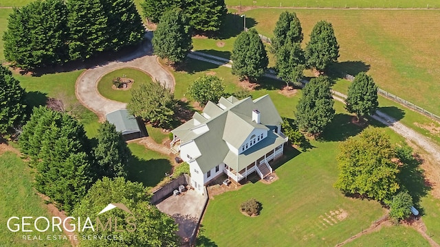 birds eye view of property featuring a rural view