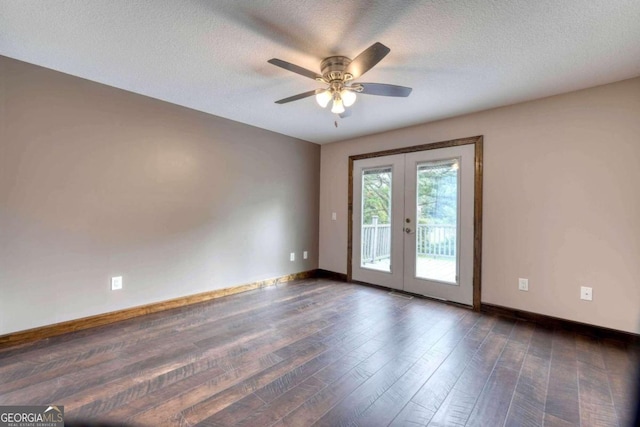 spare room featuring ceiling fan, dark hardwood / wood-style floors, a textured ceiling, and french doors