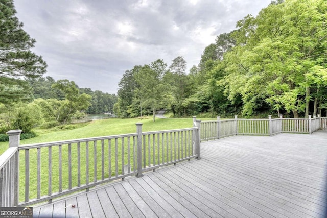 wooden deck with a yard