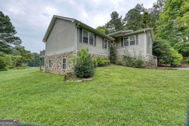 view of home's exterior featuring a yard