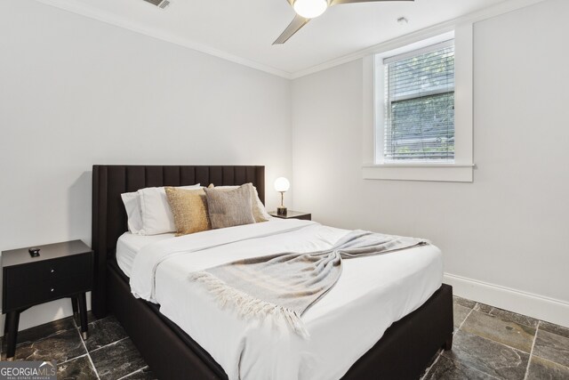 tiled bedroom with crown molding and ceiling fan