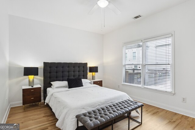 bedroom with ceiling fan and light hardwood / wood-style flooring