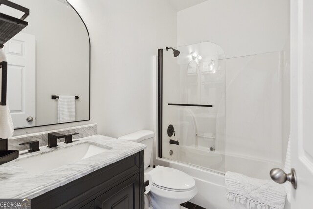 full bathroom featuring bathtub / shower combination, toilet, and vanity