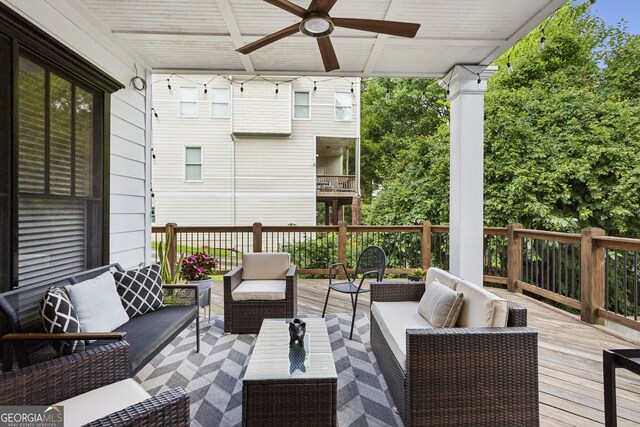 wooden deck featuring an outdoor hangout area and ceiling fan