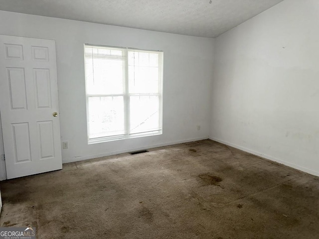 unfurnished room with carpet floors