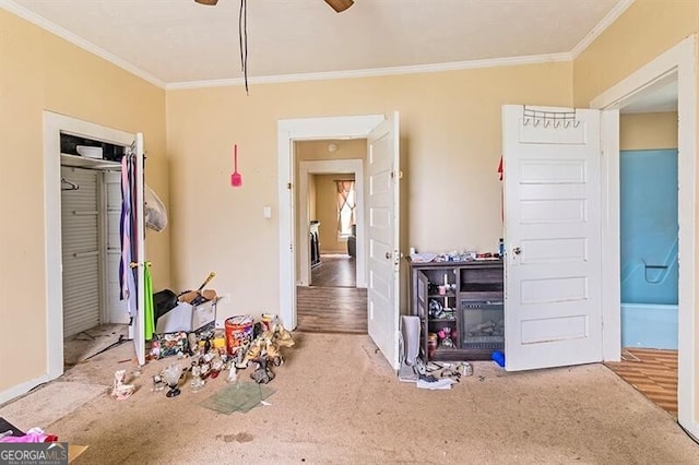 bedroom featuring ceiling fan, wood-type flooring, and ornamental molding