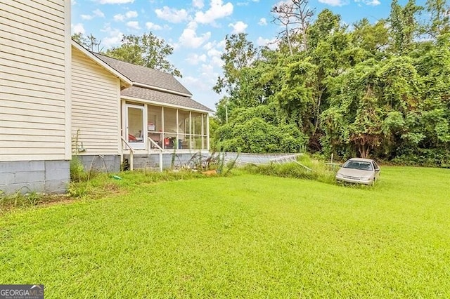 view of yard with a sunroom