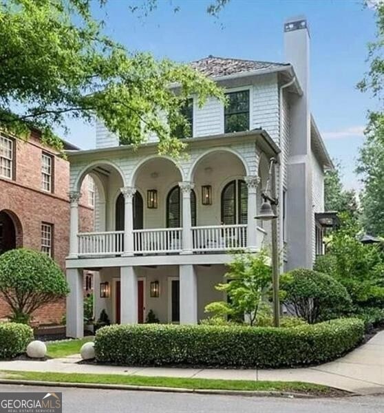 view of front of house featuring a balcony