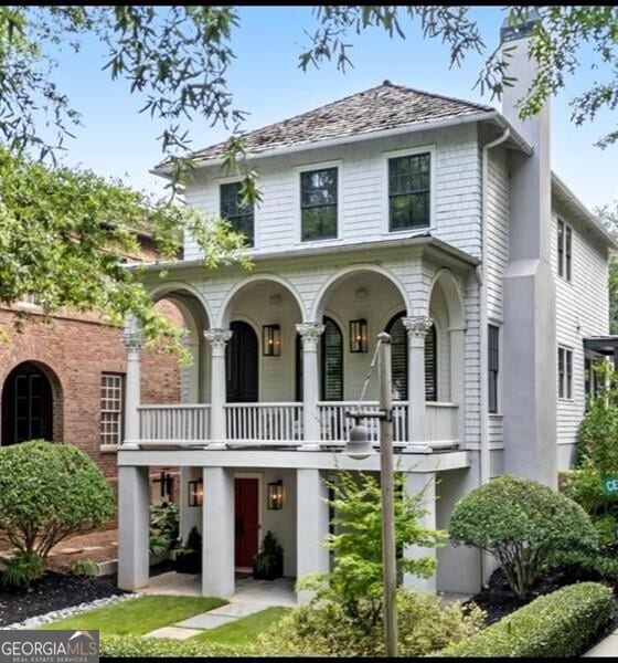 view of front of home featuring a balcony and a porch