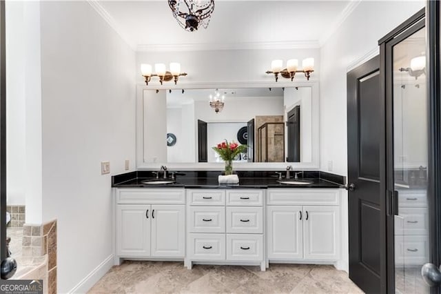 bathroom featuring crown molding and vanity