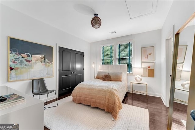 bedroom with hardwood / wood-style flooring