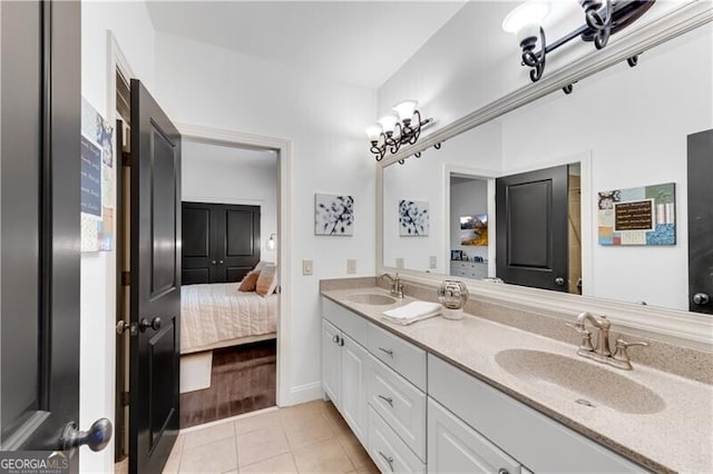 bathroom featuring tile patterned flooring and vanity