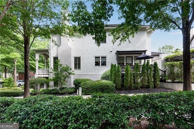 view of front of house with a balcony