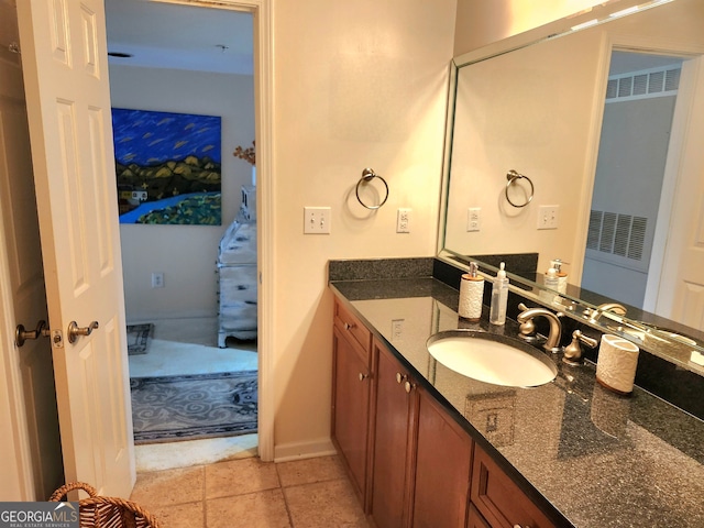 bathroom with tile patterned floors and vanity