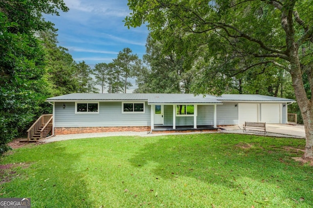 ranch-style house with a front yard and a garage