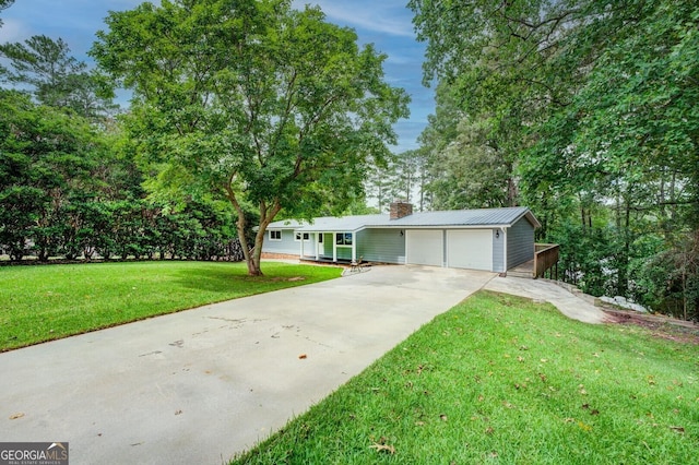 view of front facade with a garage and a front lawn